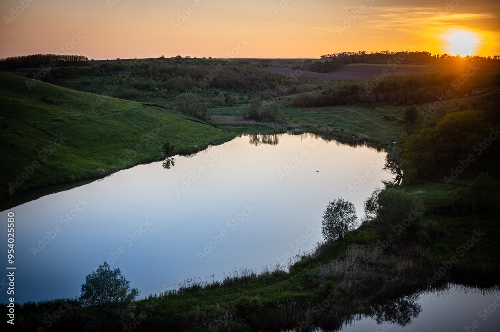Obraz premium Nature landscape with the lake in sunset