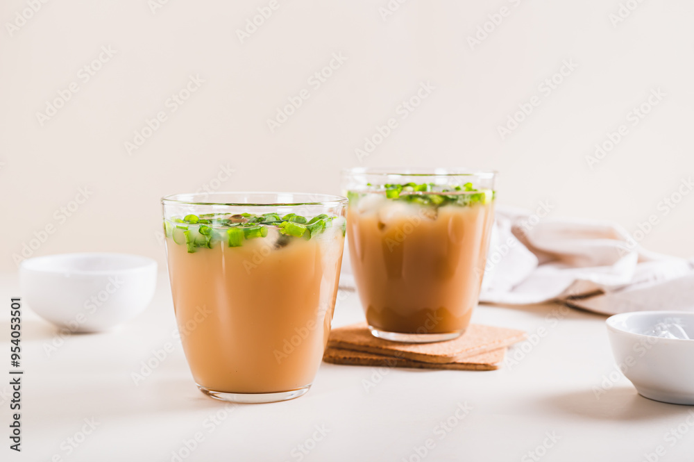 Spring iced scallion latte in glasses on the table Spring iced scallion latte in glasses on the table