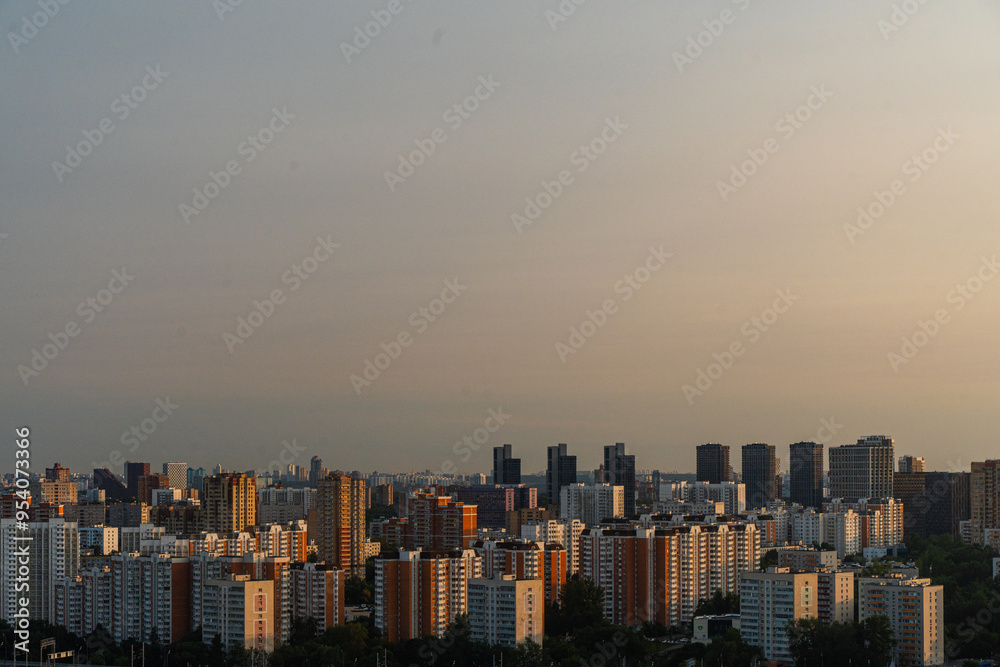 Moscow, Russia, August 12, 2024: A large city at sunset, a view from above, many multi-storey residential buildings. District of Moscow. Moscow, Russia, August 12, 2024: A large city at sunset, a view from above, many multi-storey residential buildings. District of Moscow.