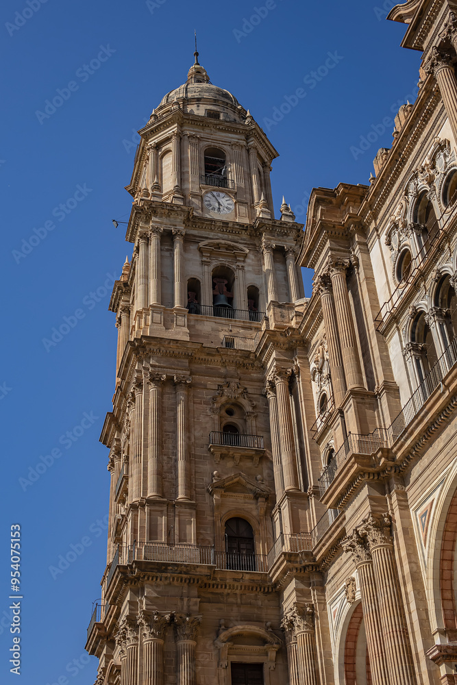 Architectural fragments of Malaga Cathedral facade. Renaissance Cathedral - Roman Catholic Church in the city of Malaga, was constructed between 1528 and 1782. Malaga, Costa del Sol, Andalusia, Spain. Architectural fragments of Malaga Cathedral facade. Renaissance Cathedral - Roman Catholic Church in the city of Malaga, was constructed between 1528 and 1782. Malaga, Costa del Sol, Andalusia, Spain.