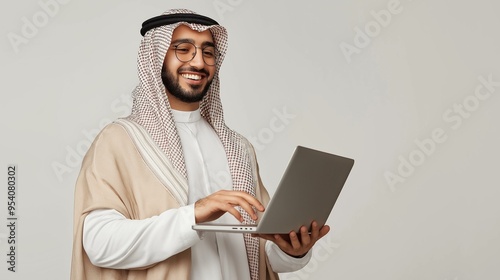 Arab middle eastern Saudi man using laptop isolated background