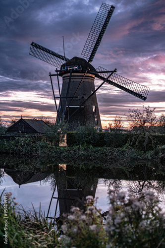 Windmills in Kinderdijk. Dutch windmills at sunset photo