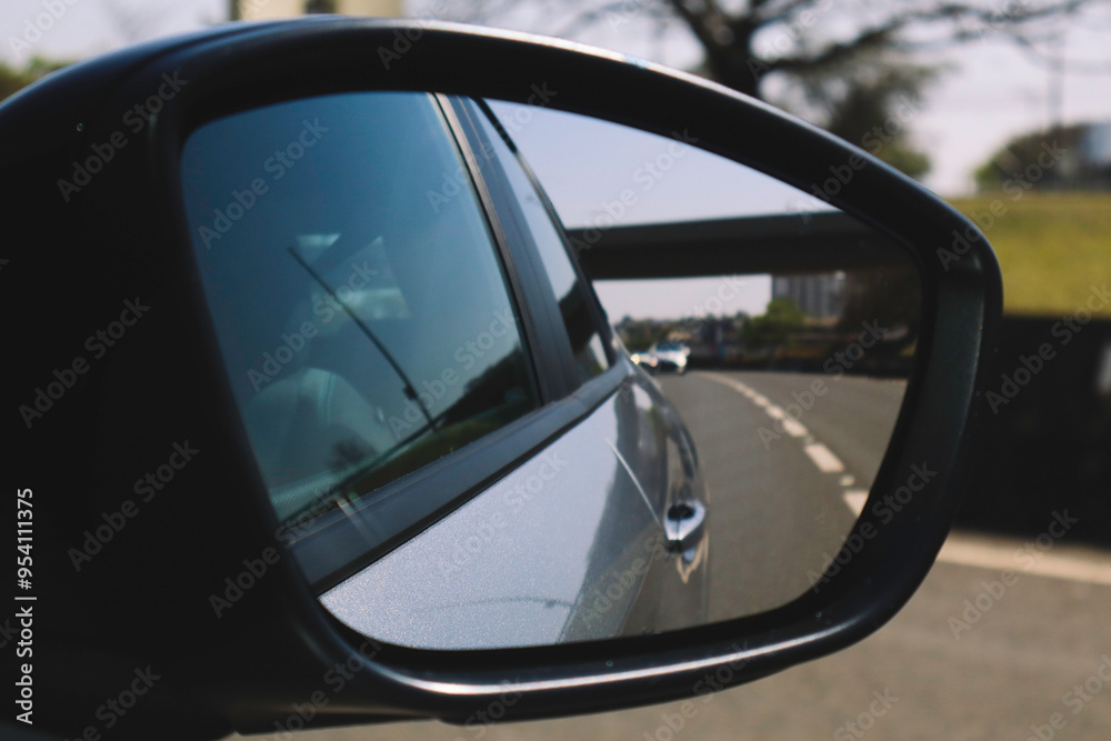 Rearview Mirror Reflection: Cars on a Busy Road Rearview Mirror Reflection: Cars on a Busy Road