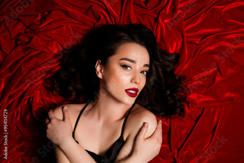 Top photo of lady lover feel tempting passion self hug lying on red velvet textile color background