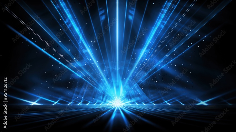 Fototapeta premium A vibrant blue light burst with rays and particles, creating a dynamic visual effect.