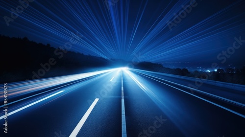 A nighttime road with light trails, suggesting speed and motion.