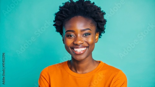 Portrait of smiling Latino woman, posing in studio shot.