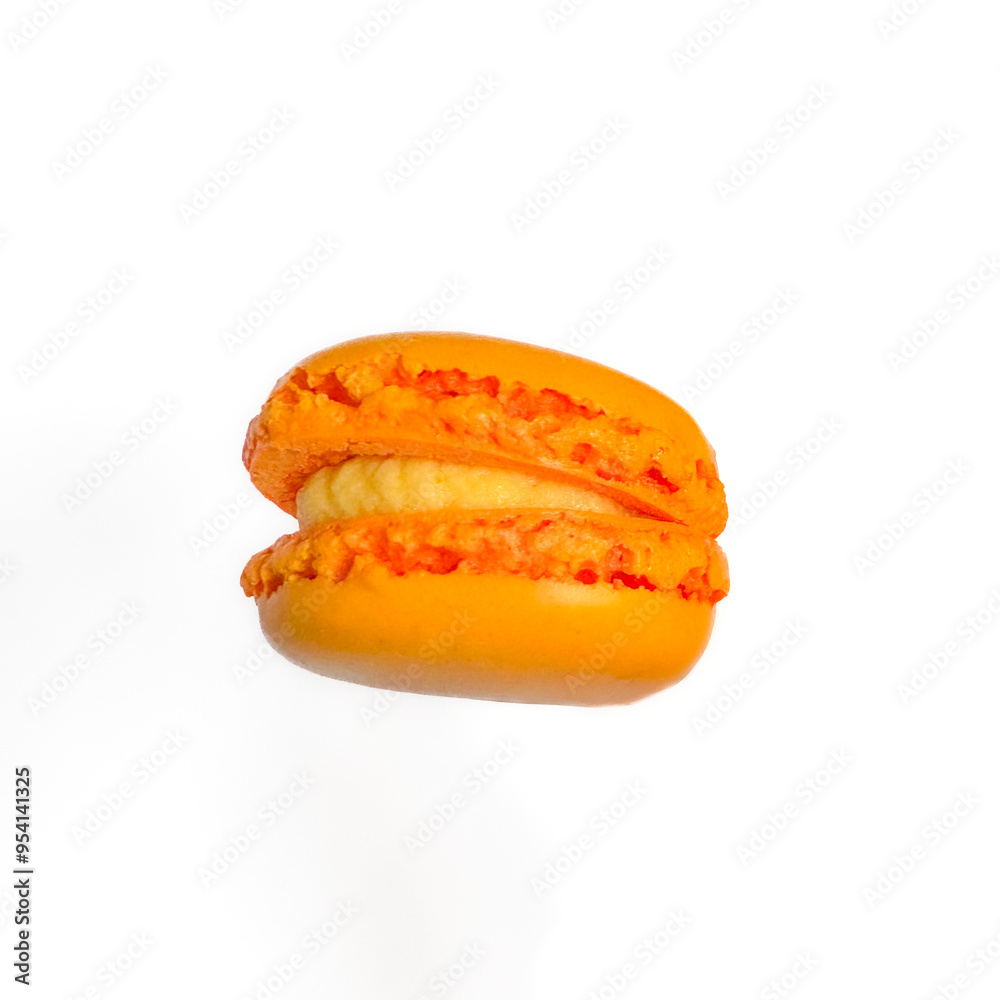 Sweet orange macarons with orange flavor isolated on white background. Delicious colorful macarons. Sweets isolated on a white background. Photos of cookies for banners and websites. Sweet orange macarons with orange flavor isolated on white background. Delicious colorful macarons. Sweets isolated on a white background. Photos of cookies for banners and websites.