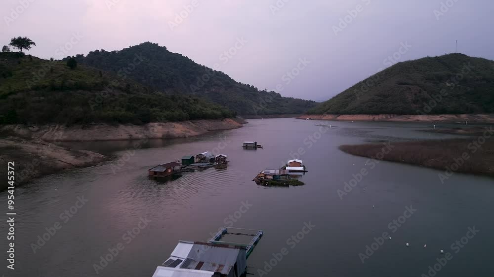 panoramic drone view of big river with fishmongers huts in the water at dusk in vietnam panoramic drone view of big river with fishmongers huts in the water at dusk in vietnam