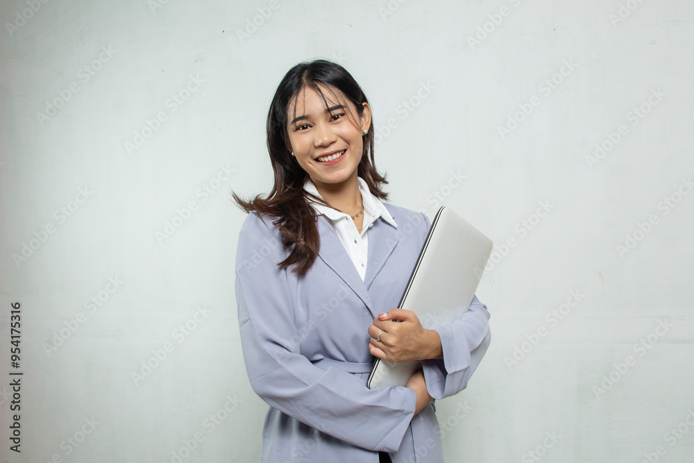 portrait Beautiful Asian business woman with long hair standing hugging her laptop in blue shirt on white background, office woman advertisement portrait Beautiful Asian business woman with long hair standing hugging her laptop in blue shirt on white background, office woman advertisement