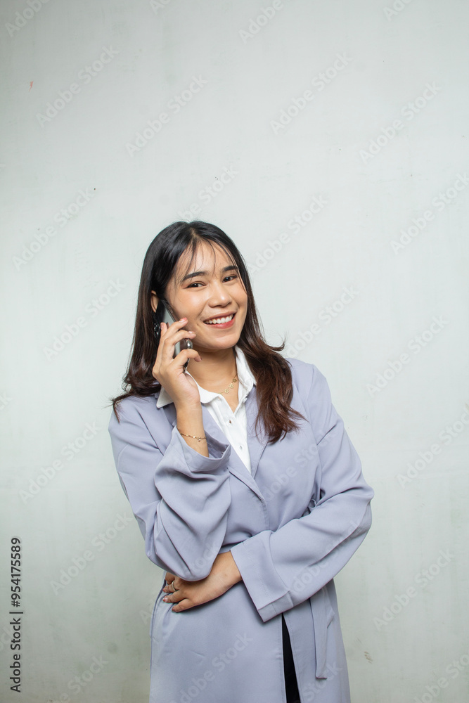 portrait of beautiful saleswoman or businesswoman standing talking to customer, she is wearing blue and purple shirt, isolated on white portrait of beautiful saleswoman or businesswoman standing talking to customer, she is wearing blue and purple shirt, isolated on white