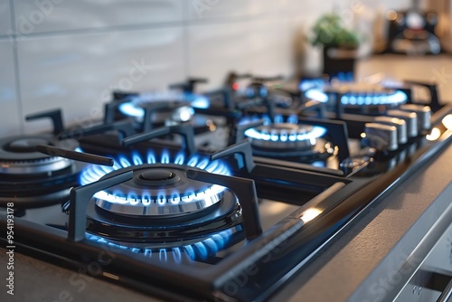 Gas burner with blue flames in the kitchen