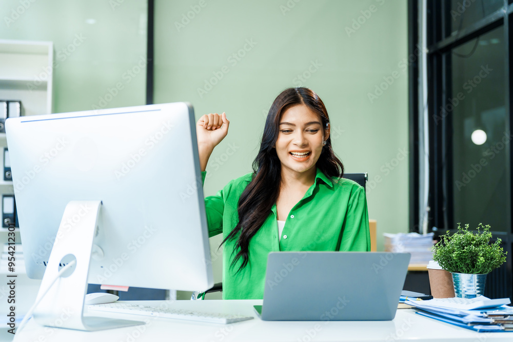 successful and happy young Asian businesswoman in a formal suit works at her desk in a modern glass office. consults on business strategies LGBTQ inclusivity, managing multiple projects efficiently. successful and happy young Asian businesswoman in a formal suit works at her desk in a modern glass office. consults on business strategies LGBTQ inclusivity, managing multiple projects efficiently.