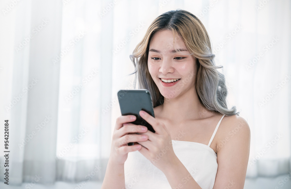 Portrait of young beautiful asian woman relax use smartphone gadget in bedroom. Smile happy asian girl online shopping work from home. Education e-commerce freelance technology connected asia people Portrait of young beautiful asian woman relax use smartphone gadget in bedroom. Smile happy asian girl online shopping work from home. Education e-commerce freelance technology connected asia people