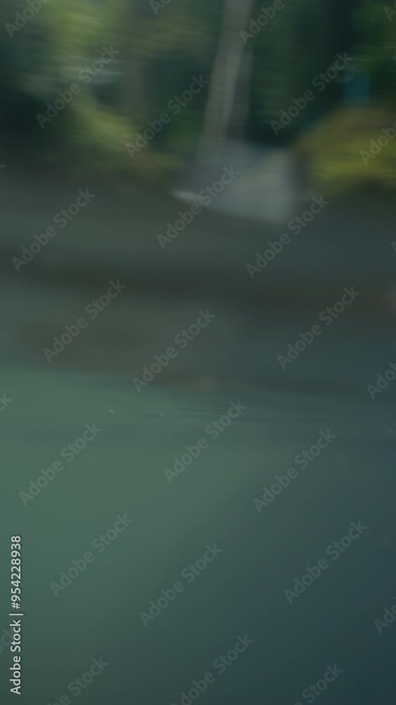 Waterfall rushing into a pool of water in a rainforest Jungle Waterfall rushing into a pool of water in a rainforest Jungle