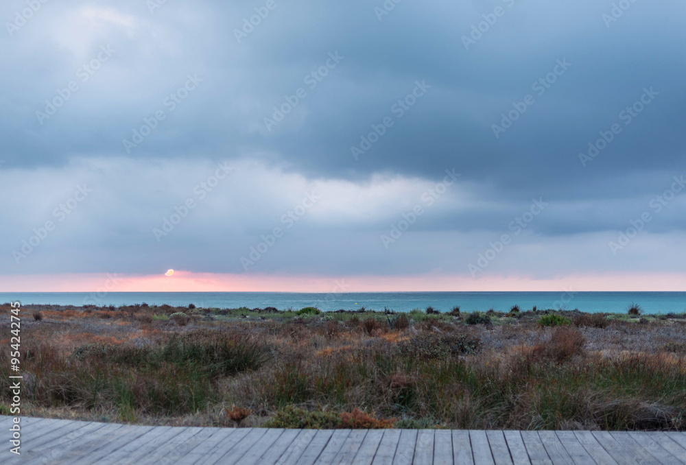sunrise on the beach with wooden walkway sunrise on the beach with wooden walkway