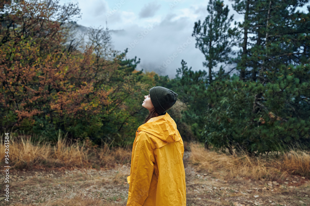 Solitude in Nature A Person in a Yellow Raincoat Contemplating the Vast Sky in the Middle of a Field