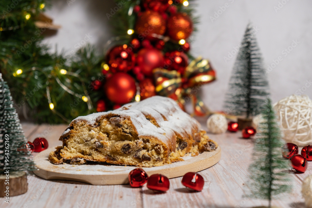 Homemade Christmas traditional cake pie with marzipan nuts and dried fruits pastry dessert stollen. Winter holidays season atmosphere. Delicious tasty composition home table setting Copy space Homemade Christmas traditional cake pie with marzipan nuts and dried fruits pastry dessert stollen. Winter holidays season atmosphere. Delicious tasty composition home table setting Copy space