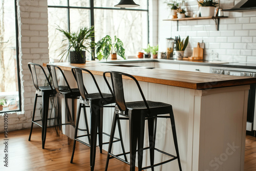 Four black metal and wood bar stools with square seats on white oak floor, featuring a kitchen island in the background.