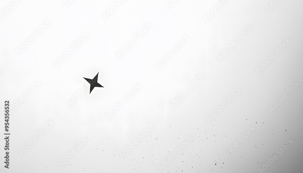 Obraz premium A mostly blank background with a small, centered design, like a tiny star or dot, emphasizing simplicity and space