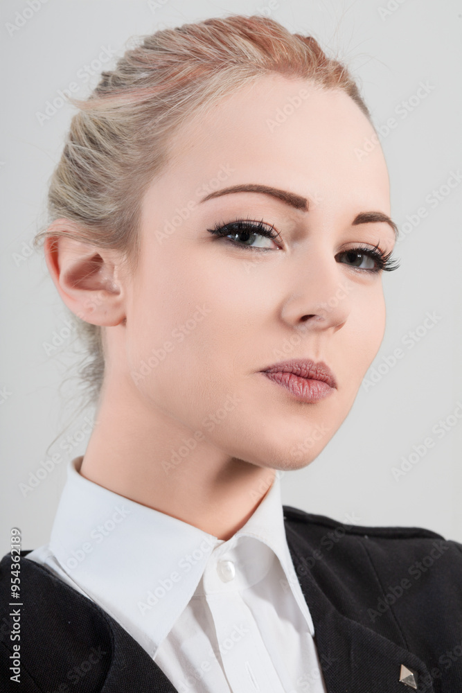 Businesswoman with serious expression posing in studio