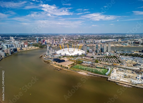 The drone aerial view of Greenwich Peninsula and River Thames. The Greenwich Peninsula is an area of Greenwich in South East London, England.