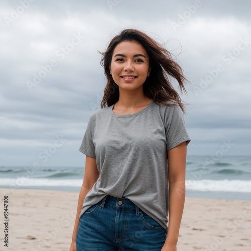 Lady's Assurance on Beach with Soft Waves and Gray Cloudy Skies 