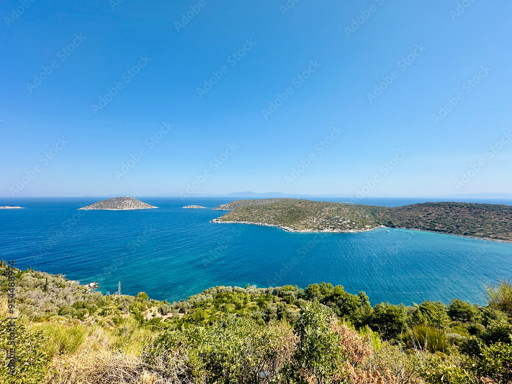 Fototapeta premium Aerial view of turquoise blue Mediterranean water on the coast of Samos, Greek Aegean Sea