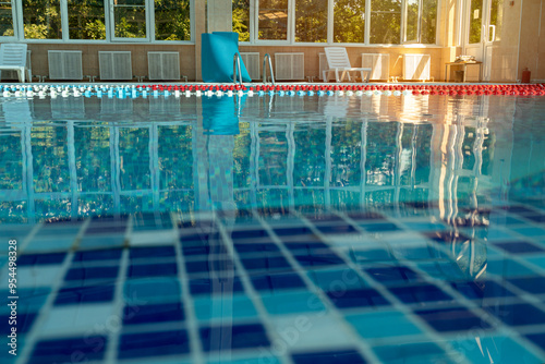 Valokuva An indoor swimming pool awaits swimmers for training or leisure
