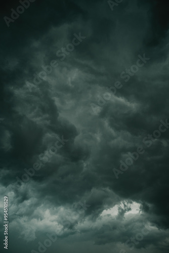 Ominous dark supercell stormy clouds in summer