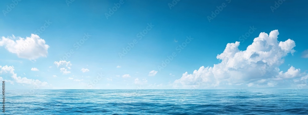 A expansive water body beneath a blue sky Above, clouds populate the heavens, and a solitary boat floats in the water's heart A expansive water body beneath a blue sky Above, clouds populate the heavens, and a solitary boat floats in the water's heart
