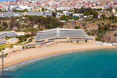 Picturesque view of Al Hoceima city and modern hotel buildings on the shore of the Mediterranean Sea bay photo