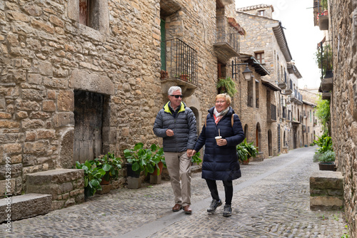 Senior couple visiting Ainsa, one of the beautiful villages of Spain.