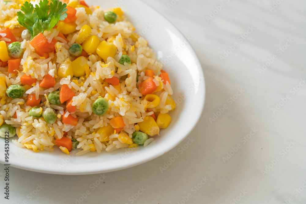fried rice with mixed vegetable (carrot, green bean peas, corn) and egg fried rice with mixed vegetable (carrot, green bean peas, corn) and egg