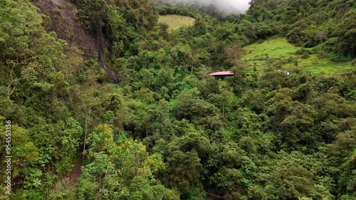 Aerial view of Mundug waterfall cascading through lush landscape of Patate, Ecuador photo