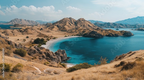 Panoramic shot of Komodo Island, with rugged landscapes, dry savannah, and turquoise waters around the coastline