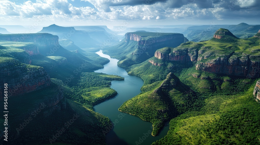 Top view of Blyde River Canyon, showcasing its dramatic cliffs, green valleys, and winding river below Top view of Blyde River Canyon, showcasing its dramatic cliffs, green valleys, and winding river below
