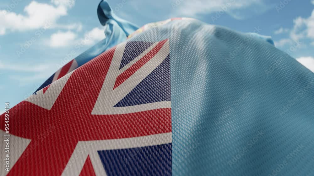 Wavy flag of Fiji blowing in the wind in slow motion. Waving colorful Fijian flag team symbol abstract vertical background. Blue sky with clouds. World countries flying flags concept