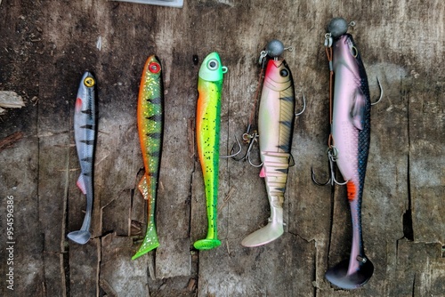Obraz na płótnie Fishing lures set, spinning ger, angling, sport fishing, catch and release, fish bait isolated on aged wood background w salonie