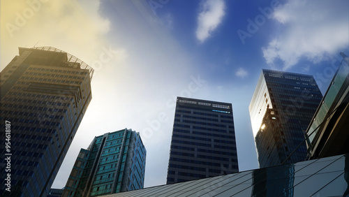 city skyscrapers,Modern Cityscape at Dusk, High-Rise Buildings Reflecting Sunlight Under a Blue and Sunset Sky