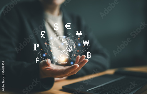 Online internet banking interbank payment concept. Woman with virtual global currency symbols on hand. Money transfers and currency exchanges between countries of the world. Business finance. photo