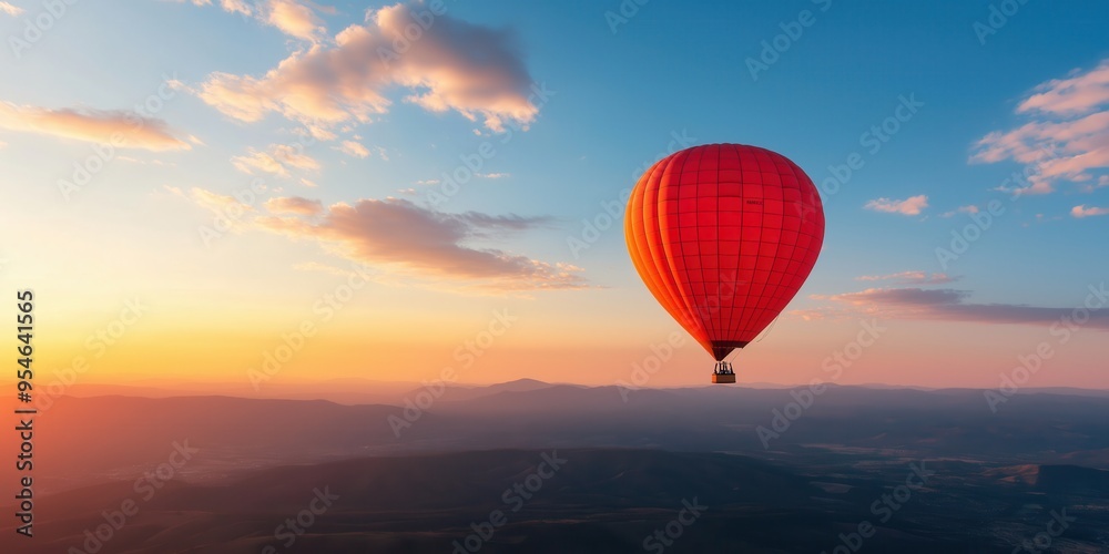 A beautiful sunrise landscape with a red hot air balloon in sky A beautiful sunrise landscape with a red hot air balloon in sky