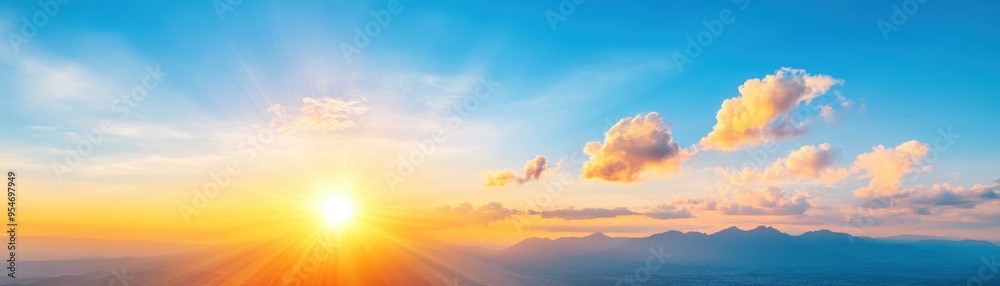 Fototapeta premium Breathtaking sunrise over mountains with vibrant colors and clouds creating a serene atmosphere, perfect for nature lovers.