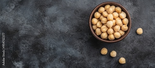 Bowl with macadamia nuts on...