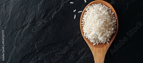 jasmine rice on a wooden sp...