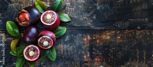 Mangosteen fruit on a woode...