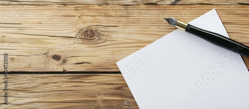 blank paper and pen on a wo...