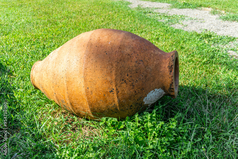 Small Kvevri Qvevri Churi on the grass - earthenware clay vessel used for the fermentation, storage and ageing of traditional Georgian wine. Small Kvevri Qvevri Churi on the grass - earthenware clay vessel used for the fermentation, storage and ageing of traditional Georgian wine.