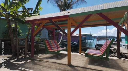 Wallpaper Mural Colorful beachside cabanas and hammocks under a bright, sunny sky in Bastimentos Island, Panama Torontodigital.ca