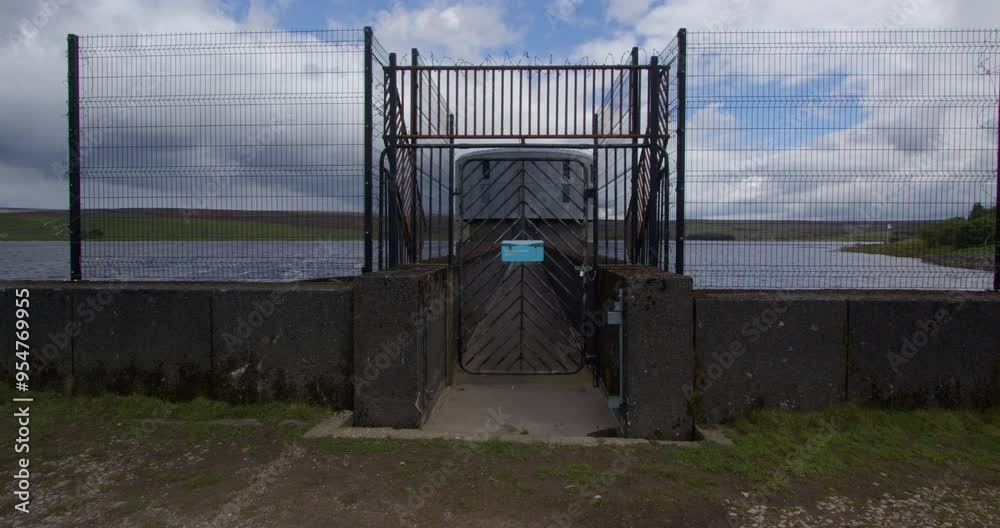 Gated entrance to the dam control tower at Grimwith Reservoir in the Yorkshire Dales Gated entrance to the dam control tower at Grimwith Reservoir in the Yorkshire Dales